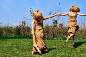 Girls Running In Field